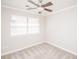 Bedroom featuring carpet flooring, neutral walls, ceiling fan, and a window at 7343 Rock Island Rd, Charlotte, NC 28278