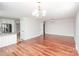 Open concept living room with hardwood floors flows seamlessly into the kitchen at 7343 Rock Island Rd, Charlotte, NC 28278