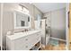 Bright bathroom featuring a modern vanity, vessel sink, stylish lighting, and a tiled shower with a glass enclosure at 8014 Kiwi Pt, Tega Cay, SC 29708