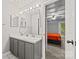 Bathroom with double vanity and modern fixtures, connects to bedroom at 8014 Kiwi Pt, Tega Cay, SC 29708