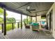 Relax on this covered deck with ceiling fans and expansive views of the water at 8014 Kiwi Pt, Tega Cay, SC 29708