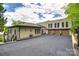 Spacious home with an expansive driveway and three-car garage, offering ample parking and outdoor space at 8014 Kiwi Pt, Tega Cay, SC 29708