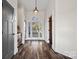Stylish foyer with hardwood floors, elegant lighting, and an open floor plan at 8014 Kiwi Pt, Tega Cay, SC 29708