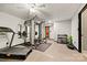 Home gym with workout equipment, free weights, and mirrors, perfect for fitness enthusiasts at 8014 Kiwi Pt, Tega Cay, SC 29708