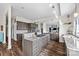Gourmet kitchen featuring custom cabinetry, granite countertops, and a center island at 8014 Kiwi Pt, Tega Cay, SC 29708