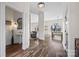 Bright, open-concept living space with hardwood floors, elegant trim, and seamless flow to dining area at 8014 Kiwi Pt, Tega Cay, SC 29708