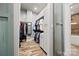 Spacious walk-in closet with custom shelving and ample storage for clothing and accessories at 8014 Kiwi Pt, Tega Cay, SC 29708