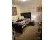 Cozy bedroom with a dark wood bed frame, neutral walls, and complementary décor at 806 Dale Ave, Charlotte, NC 28216