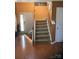Inviting entryway showcasing a staircase with wood railings and hardwood floors, leading to the upper level at 806 Dale Ave, Charlotte, NC 28216