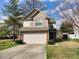 Charming two-story home with stone accents, a well-manicured lawn, and an attached two-car garage at 806 Dale Ave, Charlotte, NC 28216