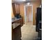 Functional kitchen design with stainless steel appliances, dark cabinets, and easy access to the laundry area at 806 Dale Ave, Charlotte, NC 28216