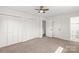 Bedroom with plush carpeting, ample closet space, and easy access to an ensuite bathroom at 809 E 23Rd Street St, Newton, NC 28658