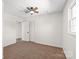 Spacious bedroom featuring neutral carpet, ceiling fan, closet, and plenty of natural light at 809 E 23Rd Street St, Newton, NC 28658