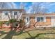 Charming brick home featuring a welcoming front entrance with decorative door and manicured landscaping at 809 E 23Rd Street St, Newton, NC 28658