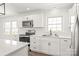 This kitchen features stainless steel appliances, ample counter space, and bright natural light at 809 E 23Rd Street St, Newton, NC 28658