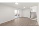 Open living area with wood floors and natural light from sliding doors to the outdoor patio at 809 E 23Rd Street St, Newton, NC 28658