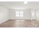 Sun-filled living room with large windows and modern flooring. This space is both inviting and functional at 809 E 23Rd Street St, Newton, NC 28658
