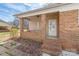 Charming side porch featuring brick accents and a welcoming entrance at 809 E 23Rd Street St, Newton, NC 28658