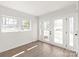 Bright sunroom with large windows and glass doors leading to the backyard at 809 E 23Rd Street St, Newton, NC 28658