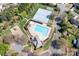 Aerial view of community amenities, including a pool, tennis courts, playground, and well-maintained green spaces at 8201 Tonawanda Dr, Charlotte, NC 28277