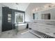 Modern primary bathroom with dual sink vanity, soaking tub, and walk-in shower at 8201 Tonawanda Dr, Charlotte, NC 28277
