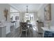 Elegant dining room featuring stylish furniture, modern lighting, and bright natural light at 8201 Tonawanda Dr, Charlotte, NC 28277