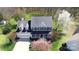 Charming two-story home featuring a covered front porch and manicured lawn at 8201 Tonawanda Dr, Charlotte, NC 28277