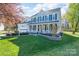 Beautiful two-story home with a welcoming front porch and well-maintained lawn at 8201 Tonawanda Dr, Charlotte, NC 28277