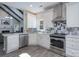 Well-lit kitchen featuring stainless steel appliances, custom cabinetry, and sleek stone countertops at 8201 Tonawanda Dr, Charlotte, NC 28277