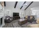 Bright living room features a fireplace, beamed ceilings, and views to the outdoor patio at 8201 Tonawanda Dr, Charlotte, NC 28277