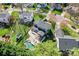 Aerial view of a house showcasing the backyard with a kidney-shaped pool and a deck with steps at 8511 Fox Tail Ln, Huntersville, NC 28078