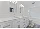 Bright bathroom with double sink vanity, large mirror, and tub at 8511 Fox Tail Ln, Huntersville, NC 28078