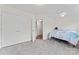 Bright bedroom with carpeted floors, large closet, and ceiling fan for optimal comfort at 8511 Fox Tail Ln, Huntersville, NC 28078