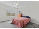 Bedroom with closet, ceiling fan, and exterior view at 8511 Fox Tail Ln, Huntersville, NC 28078