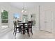Sunlit breakfast nook with large windows and space for a table and chairs to enjoy meals at 8511 Fox Tail Ln, Huntersville, NC 28078