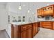 Beautiful kitchen island with granite countertops and wooden cabinets at 8511 Fox Tail Ln, Huntersville, NC 28078