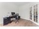 A quiet home office space with wood floors, a window, and space for a desk and computer at 8511 Fox Tail Ln, Huntersville, NC 28078