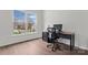 A home office boasts a large window, wood floors, and room for a desk and chair at 8511 Fox Tail Ln, Huntersville, NC 28078
