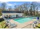 Community pool with ample seating and a covered area for relaxing poolside at 8511 Fox Tail Ln, Huntersville, NC 28078