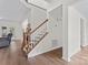 Bright, modern staircase featuring wood steps, white risers and a wood handrail at 8511 Fox Tail Ln, Huntersville, NC 28078