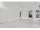 Bright sun room featuring tile floor and exterior access to the deck at 8511 Fox Tail Ln, Huntersville, NC 28078