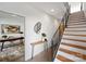 Bright entryway showcasing a staircase with iron railings and an adjacent office space at 914 Greenleaf Ave # A, Charlotte, NC 28202