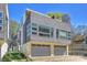 Modern home featuring a two-car garage and a stylish horizontal plank exterior with large windows at 914 Greenleaf Ave # A, Charlotte, NC 28202
