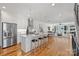 Open kitchen with stainless steel appliances, a large island, and hardwood floors at 914 Greenleaf Ave # A, Charlotte, NC 28202