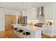 Bright kitchen showcasing a large white island with bar stools and pendant lighting at 914 Greenleaf Ave # A, Charlotte, NC 28202