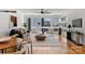 Bright living room with large windows, hardwood floors, and stylish contemporary furniture at 914 Greenleaf Ave # A, Charlotte, NC 28202