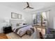 Bright and open main bedroom with a private balcony, hardwood floors, and modern decor at 914 Greenleaf Ave # A, Charlotte, NC 28202
