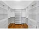 Spacious walk-in closet with custom shelving, ample storage, and hardwood floors at 914 Greenleaf Ave # A, Charlotte, NC 28202