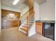 The finished basement features a bar area, staircase with wooden banister and tiled floors at 928 Thorn Ridge Ln, Clover, SC 29710