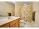 Cozy bathroom features a wooden vanity, sink, and a shower-tub combo at 928 Thorn Ridge Ln, Clover, SC 29710